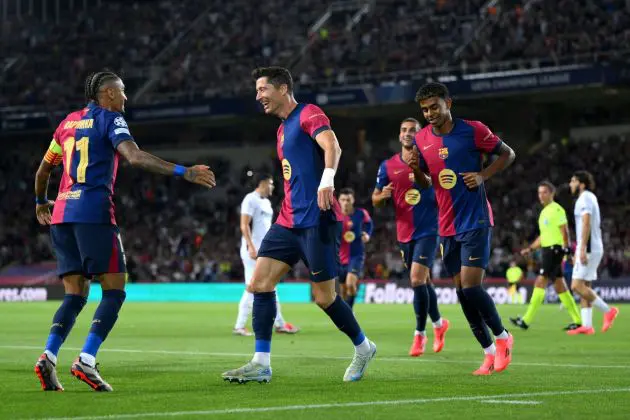 BARCELONA, SPAIN - OCTOBER 01: Robert Lewandowski of FC Barcelona celebrates scoring his team's first goal with teammate Raphinha during the UEFA Champions League 2024/25 League Phase MD2 match between FC Barcelona and BSC Young Boys at Estadi Olimpic Lluis Companys on October 01, 2024 in Barcelona, Spain.