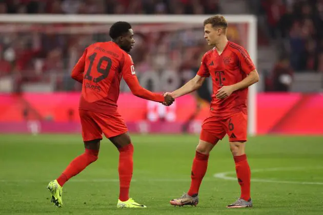 MUNICH, GERMANY - OCTOBER 19: Alphonso Davies and Joshua Kimmich of Bayern Munich interact prior to the Bundesliga match between FC Bayern München and VfB Stuttgart at Allianz Arena on October 19, 2024 in Munich, Germany.