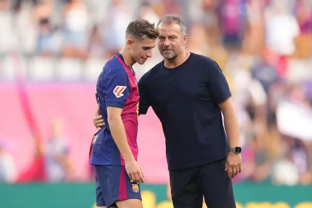 BARCELONA, SPAIN - AUGUST 31: Hansi Flick, Head Coach of FC Barcelona, interacts with Fermin Lopez of FC Barcelona following the La Liga match between FC Barcelona and Real Valladolid CF at Camp Nou on August 31, 2024 in Barcelona, Spain.