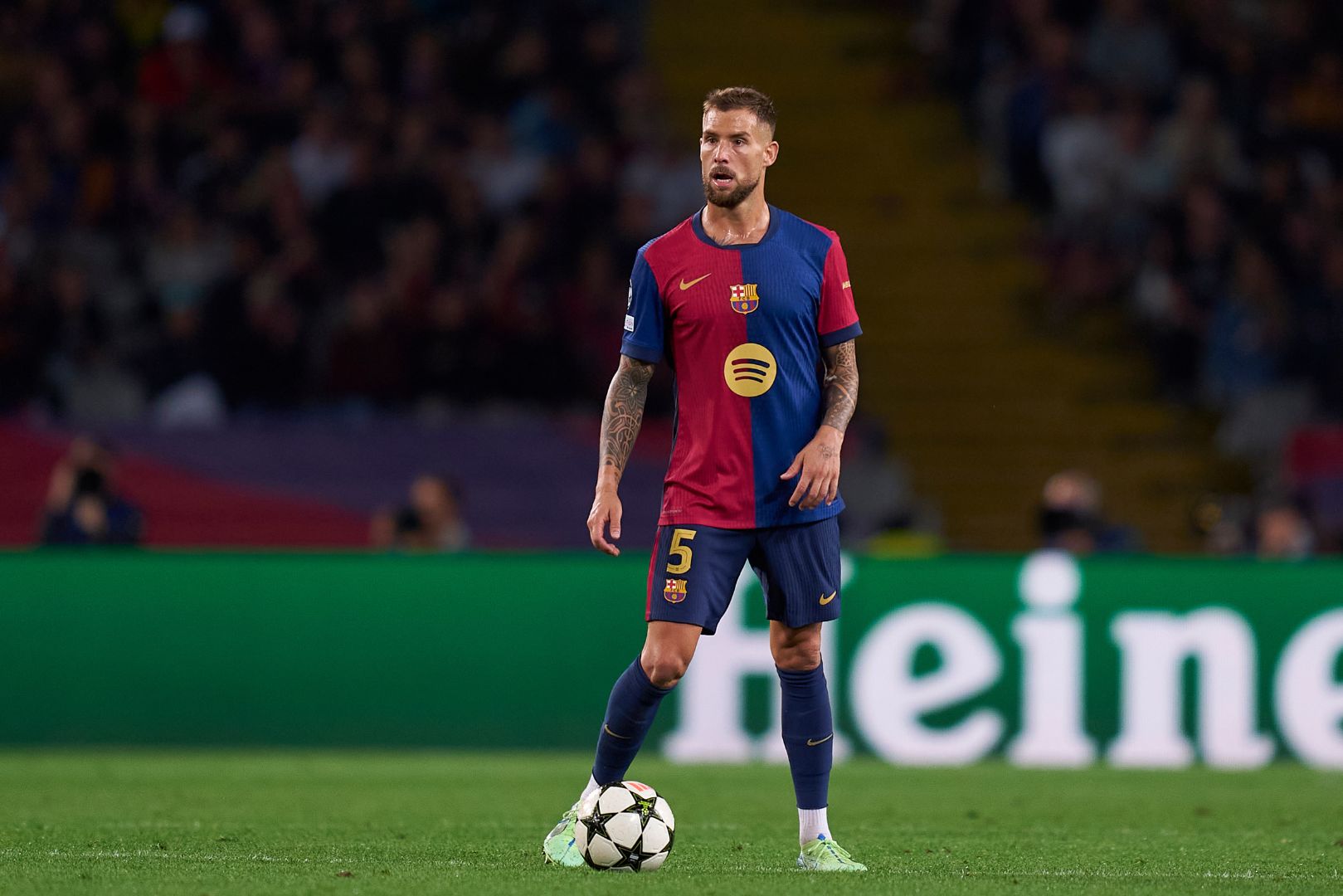 BARCELONA, SPAIN - OCTOBER 23: Inigo Martinez of FC Barcelona with the ball during the UEFA Champions League 2024/25 League Phase MD3 match between FC Barcelona and FC Bayern Munchen at Estadi Olimpic Lluis Companys on October 23, 2024 in Barcelona, Spain.