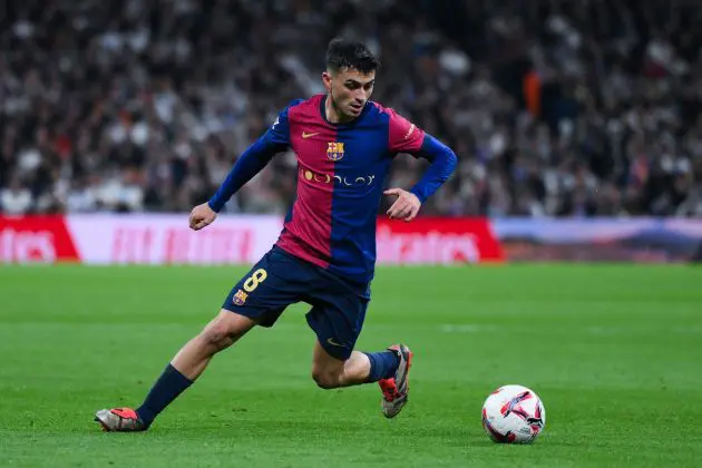 MADRID, SPAIN - OCTOBER 26: Pedri of FC Barcelona runs with the ball during the LaLiga match between Real Madrid CF and FC Barcelona at Estadio Santiago Bernabeu on October 26, 2024 in Madrid, Spain.