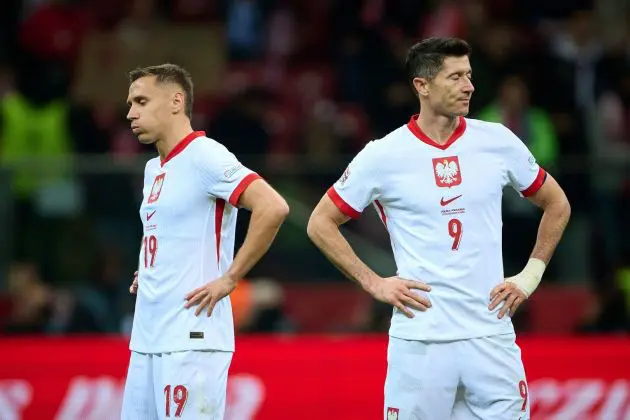 WARSAW, POLAND - OCTOBER 12: Przemyslaw Frankowski of Poland and Robert Lewandowski of Poland reacts during the UEFA Nations League 2024/25 League A Group A1 match between Poland and Portugal at PGE Narodowy on October 12, 2024 in Warsaw, Poland.