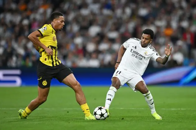 MADRID, SPAIN - OCTOBER 22: Felix Nmecha of Borussia Dortmund and Rodrygo of Real Madrid compete for the ball during the UEFA Champions League 2024/25 League Phase MD3 match between Real Madrid C.F. and Borussia Dortmund at Estadio Santiago Bernabeu on October 22, 2024 in Madrid, Spain.