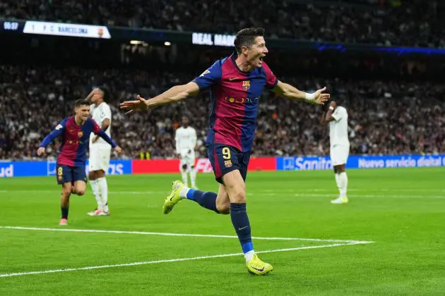 MADRID, SPAIN - OCTOBER 26: Robert Lewandowski of FC Barcelona celebrates scoring his team's second goal during the LaLiga match between Real Madrid CF and FC Barcelona at Estadio Santiago Bernabeu on October 26, 2024 in Madrid, Spain.