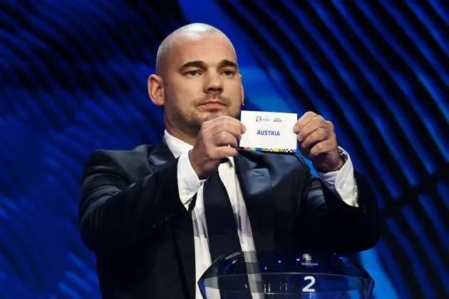 HAMBURG, GERMANY - DECEMBER 02: Special guest Wesley Sneijder​​ pulls out the card of Austria during the UEFA EURO 2024 Final Tournament Draw at Elbphilharmonie on December 02, 2023 in Hamburg, Germany.