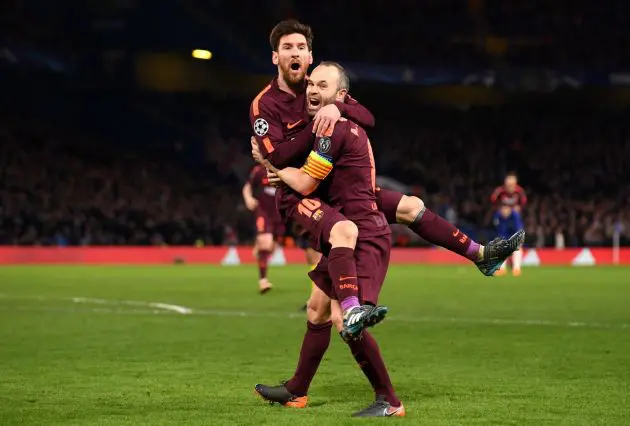 LONDON, ENGLAND - FEBRUARY 20: Lionel Messi of Barcelona celebrates with teammate Andres Iniesta after scoring his sides first goal during the UEFA Champions League Round of 16 First Leg match between Chelsea FC and FC Barcelona at Stamford Bridge on February 20, 2018 in London, United Kingdom.