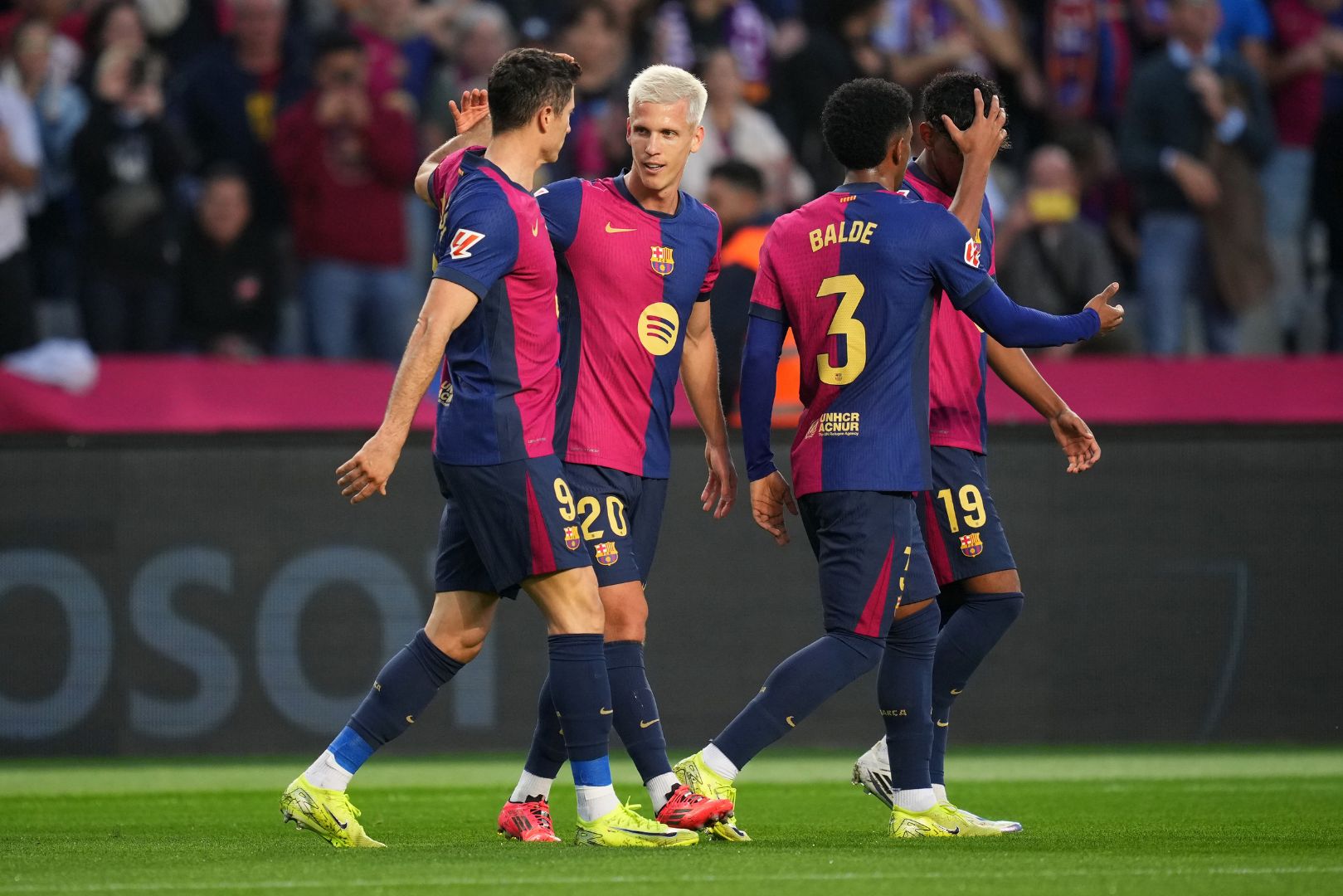 BARCELONA, SPAIN - NOVEMBER 03: Dani Olmo of FC Barcelona celebrates scoring his team's first goal with teammates during the La Liga EA Sports match between FC Barcelona and RCD Espanyol at Estadi Olimpic Lluis Companys on November 03, 2024 in Barcelona, Spain.