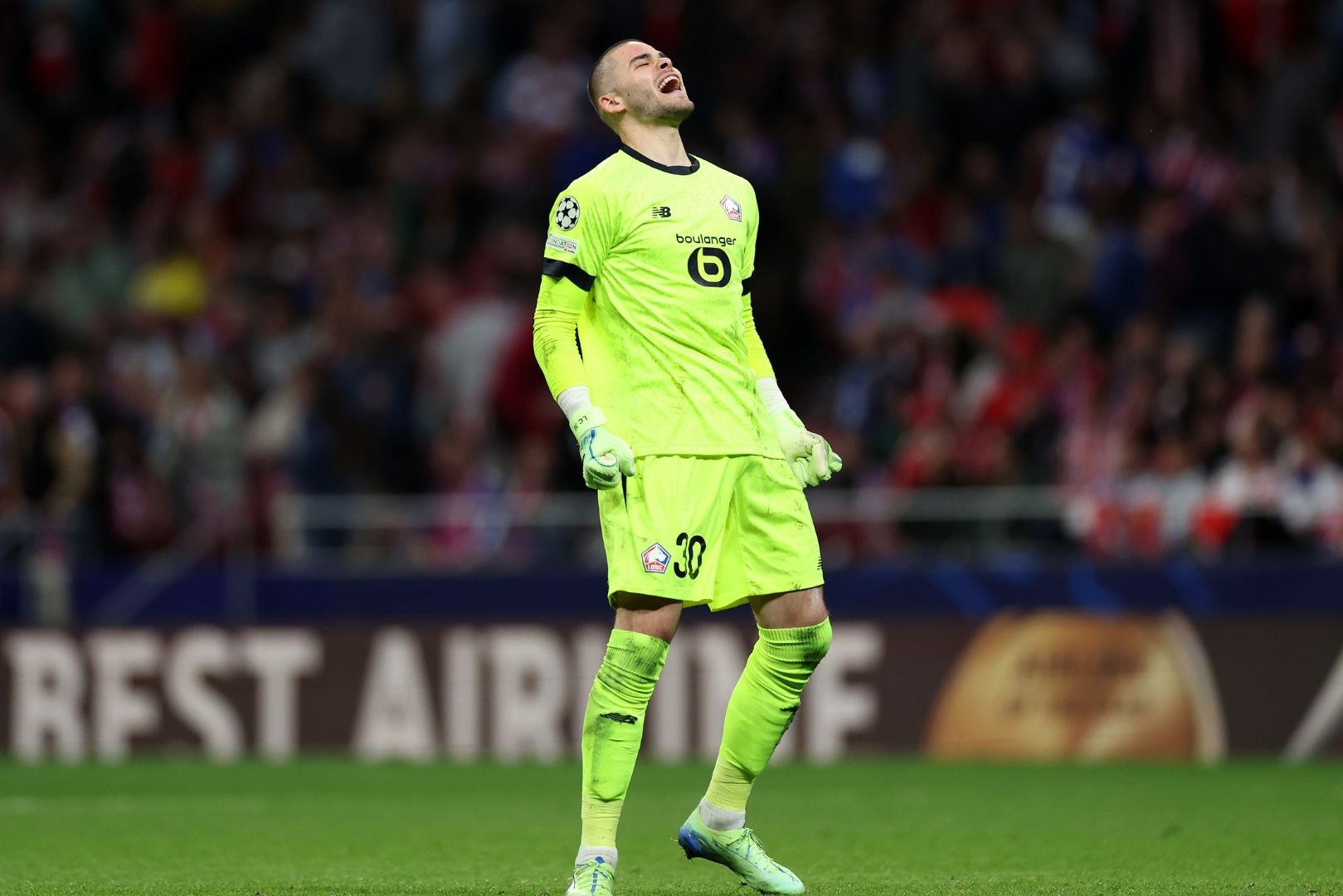 MADRID, SPAIN - OCTOBER 23: Lucas Chevalier of LOSC Lille celebrates after teammate Jonathan David (not pictured) scores his team's third goal during the UEFA Champions League 2024/25 League Phase MD3 match between Atletico de Madrid and LOSC Lille at Estadio Civitas Metropolitano on October 23, 2024 in Madrid, Spain.