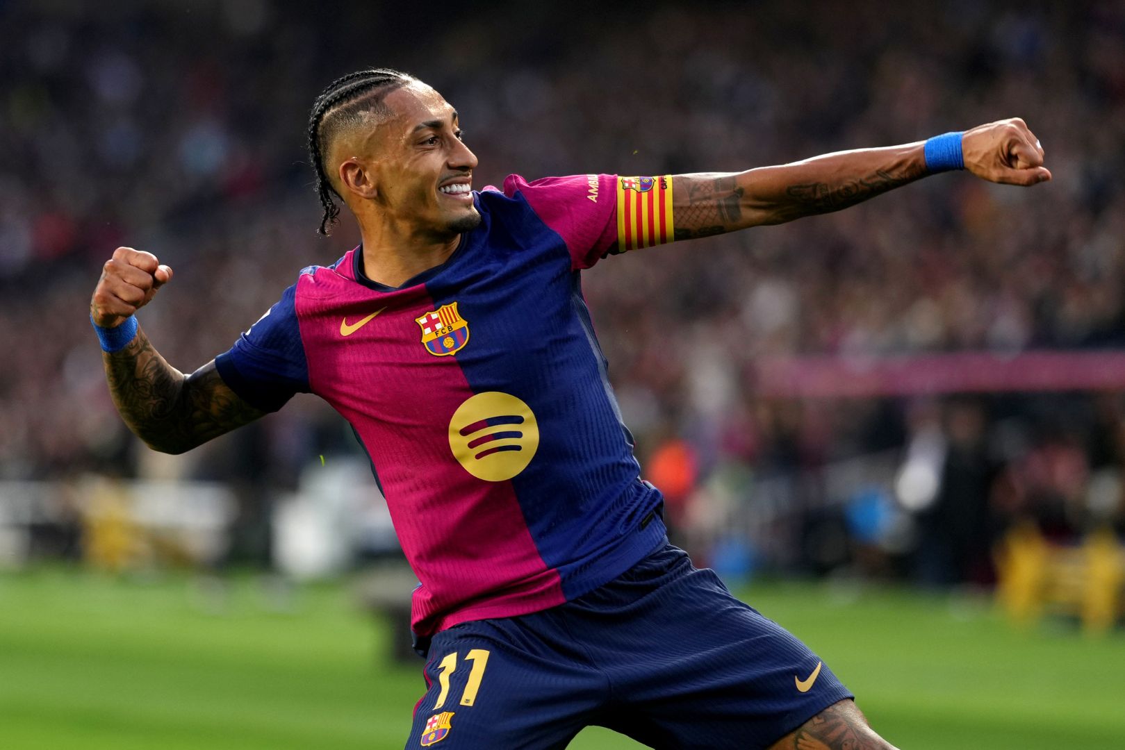 BARCELONA, SPAIN - NOVEMBER 03: Raphinha of FC Barcelona celebrates scoring his team's second goal during the La Liga EA Sports match between FC Barcelona and RCD Espanyol at Estadi Olimpic Lluis Companys on November 03, 2024 in Barcelona, Spain.