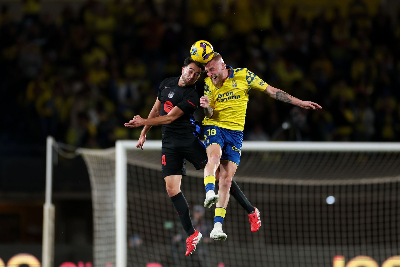 LAS PALMAS, SPAIN - FEBRUARY 22: Eric Garcia of FC Barcelona clashes with Oliver Mcburnie of UD Las Palmas during the LaLiga match between UD Las Palmas and FC Barcelona at Estadio Gran Canaria on February 22, 2025 in Las Palmas, Spain.