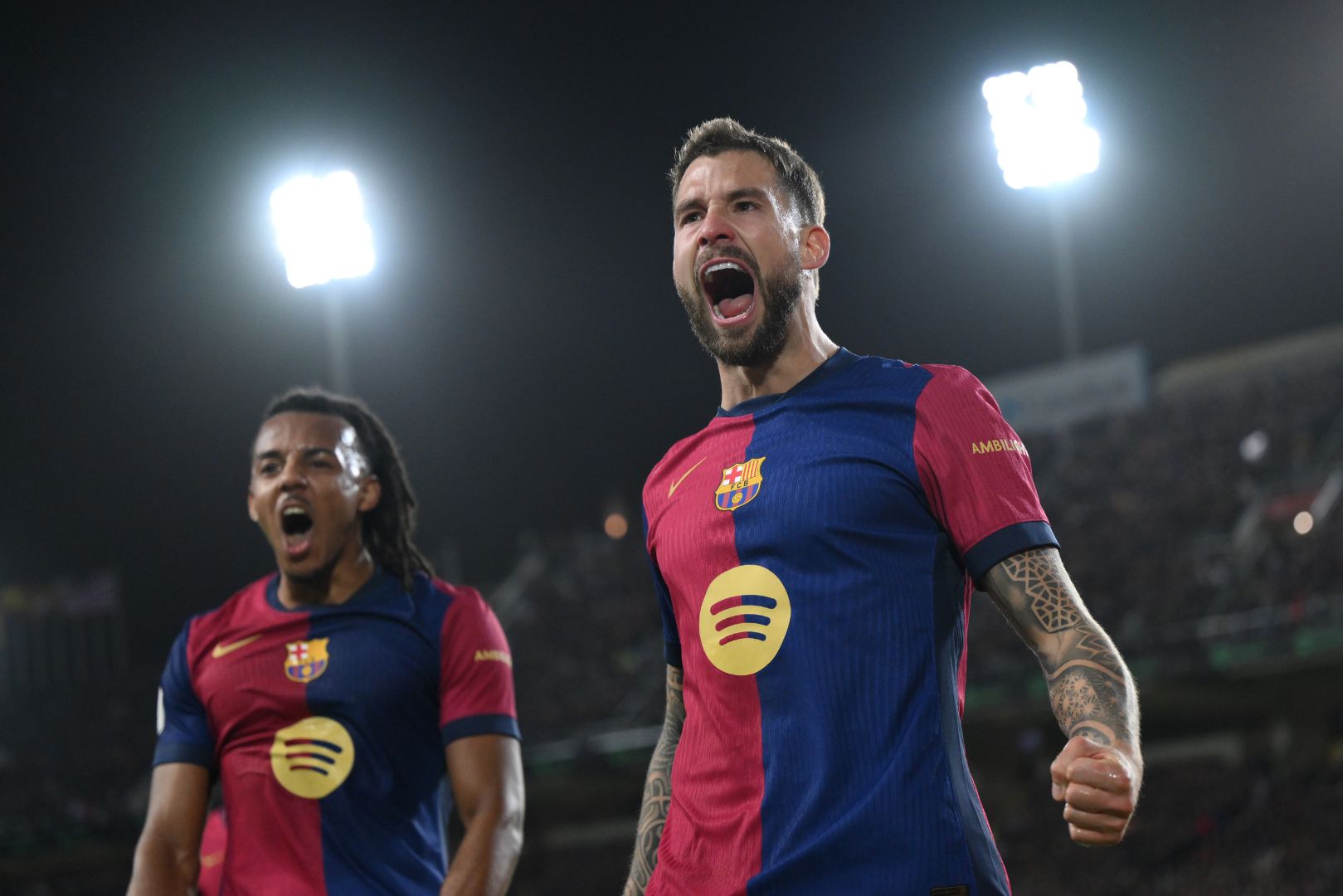 BARCELONA, SPAIN - FEBRUARY 25: Inigo Martinez of FC Barcelona celebrates scoring his team's third goal during the Copa del Rey Semi Final match between FC Barcelona and Atletico de Madrid at Estadi Olimpic Lluis Companys on February 25, 2025 in Barcelona, Spain.