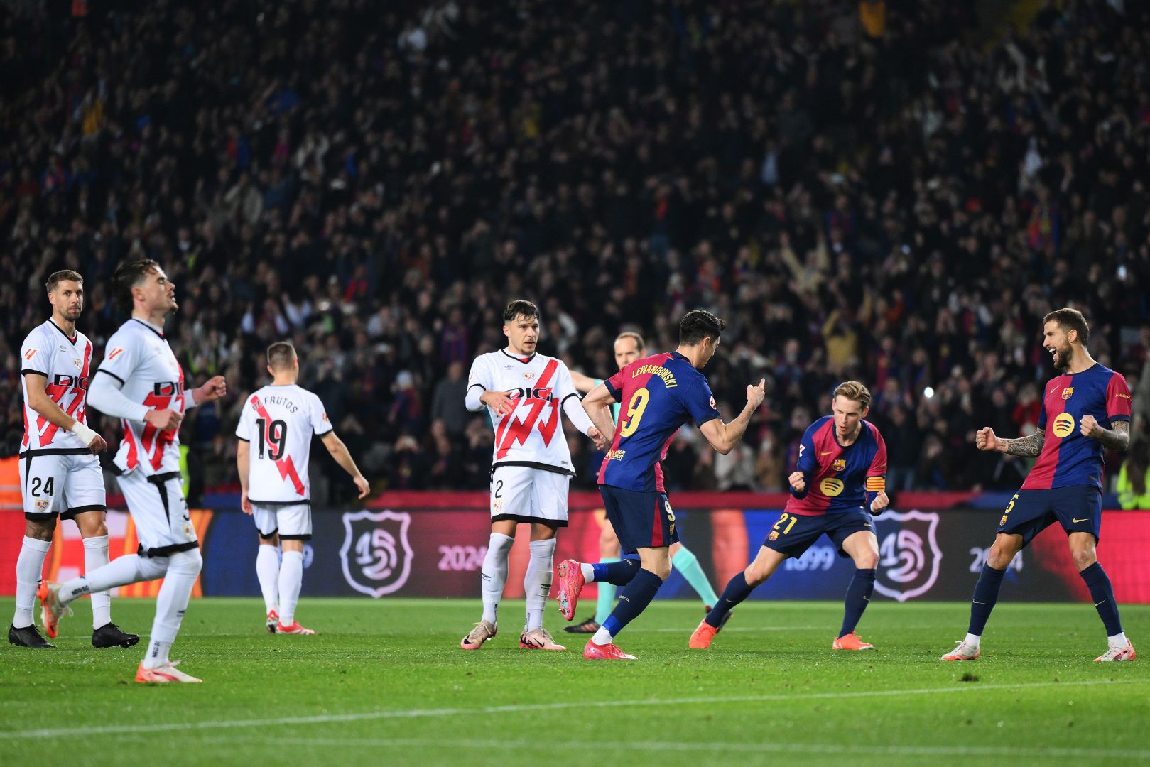 BARCELONA, SPAIN - FEBRUARY 17: Robert Lewandowski of FC Barcelona celebrates with Iñigo Martínez after scoring his team's first goal from the penalty spot during the LaLiga match between FC Barcelona and Rayo Vallecano at Estadi Olimpic Lluis Companys on February 17, 2025 in Barcelona, Spain.