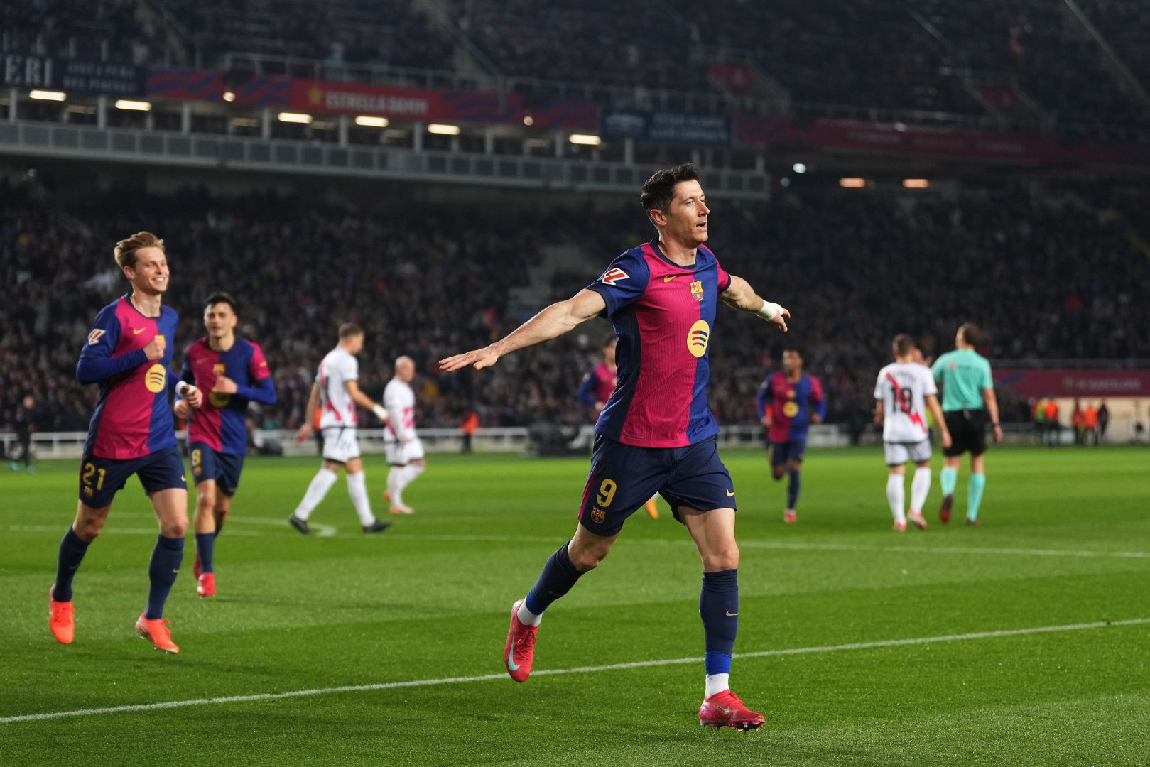 BARCELONA, SPAIN - FEBRUARY 17: Robert Lewandowski of FC Barcelona celebrates scoring his team's first goal from the penalty spot during the LaLiga match between FC Barcelona and Rayo Vallecano at Estadi Olimpic Lluis Companys on February 17, 2025 in Barcelona, Spain.
