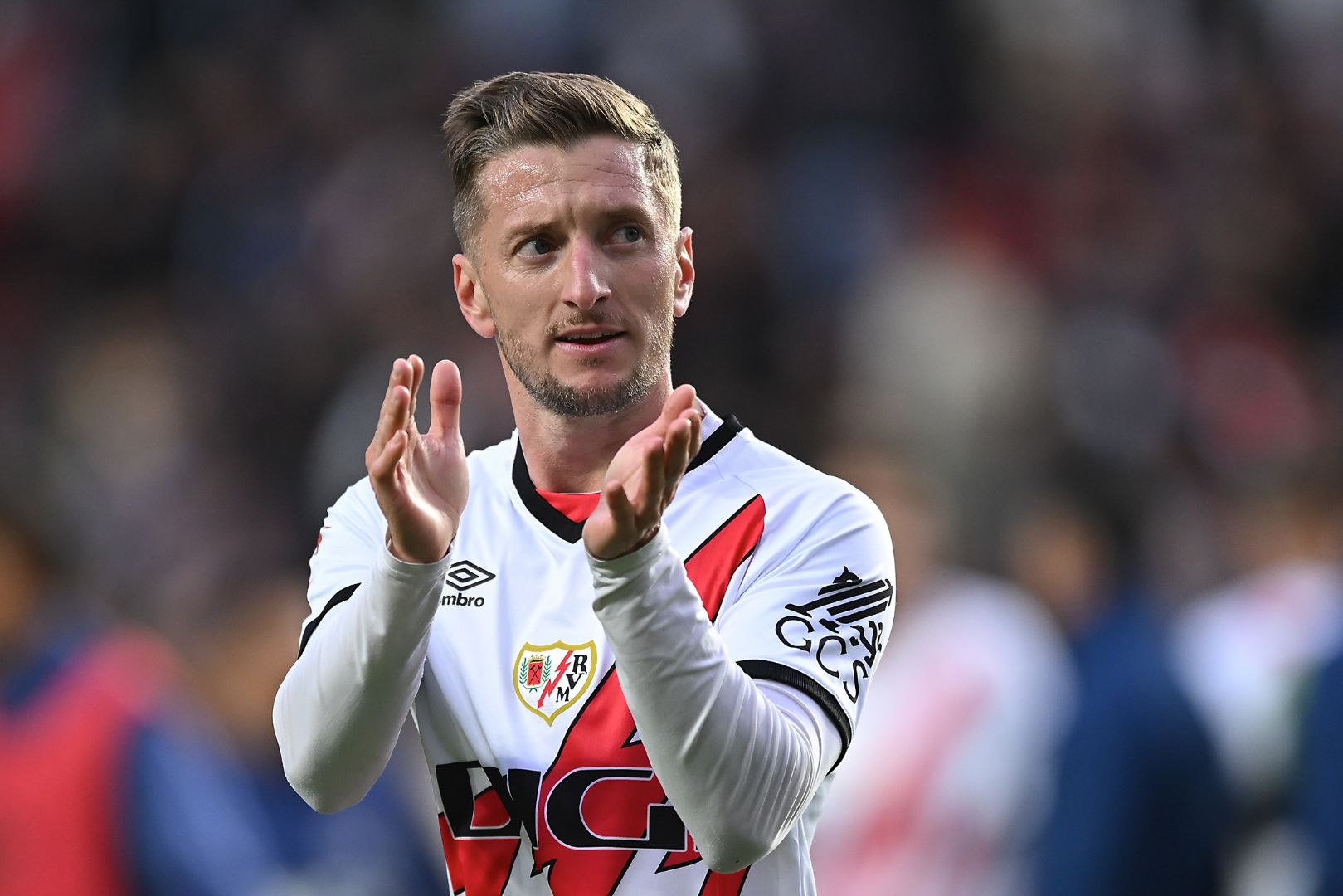 MADRID, SPAIN - OCTOBER 26: Ivan Balliu of Rayo Vallecano celebrates victory on the final whistle during the LaLiga match between Rayo Vallecano and Deportivo Alaves at Estadio de Vallecas on October 26, 2024 in Madrid, Spain.