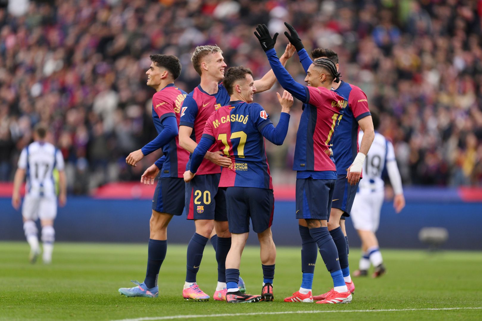BARCELONA, SPAIN - MARCH 02: Marc Casado of FC Barcelona celebrates with teammates after scoring his team's second goal during the La Liga EA match between FC Barcelona and Real Sociedad at Estadi Olimpic Lluis Companys on March 02, 2025 in Barcelona, Spain.