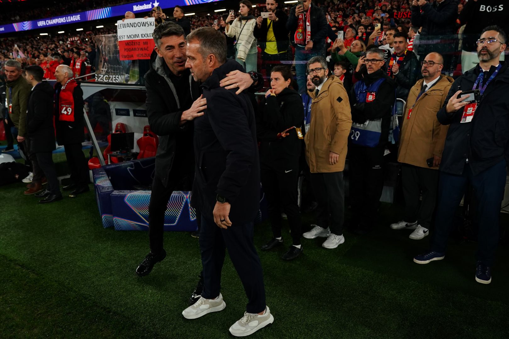 LISBON, PORTUGAL - MARCH 5: Head Coach Bruno Lage of SL Benfica with Head Coach Hans-Dieter Flick of FC Barcelona before the start of the UEFA Champions League 2024/25 Round of 16 First Leg match between SL Benfica and FC Barcelona at Estadio da Luz on March 5, 2025 in Lisbon, Portugal.