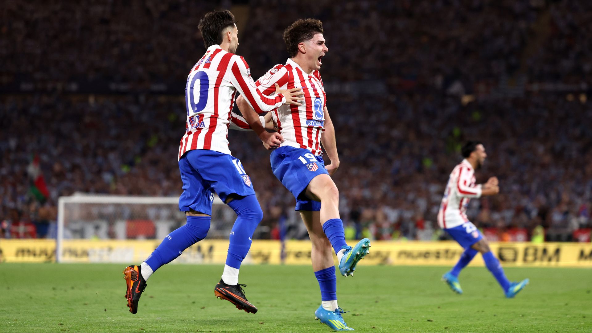 SEVILLE, SPAIN - APRIL 18: Julian Alvarez of Atletico de Madrid celebrates scoring his team's second goal with teammate Alex Baena during the Copa Del Rey Final match between Real Sociedad and Atletico de Madrid at Estadio de La Cartuja on April 18, 2026 in Seville, Spain.