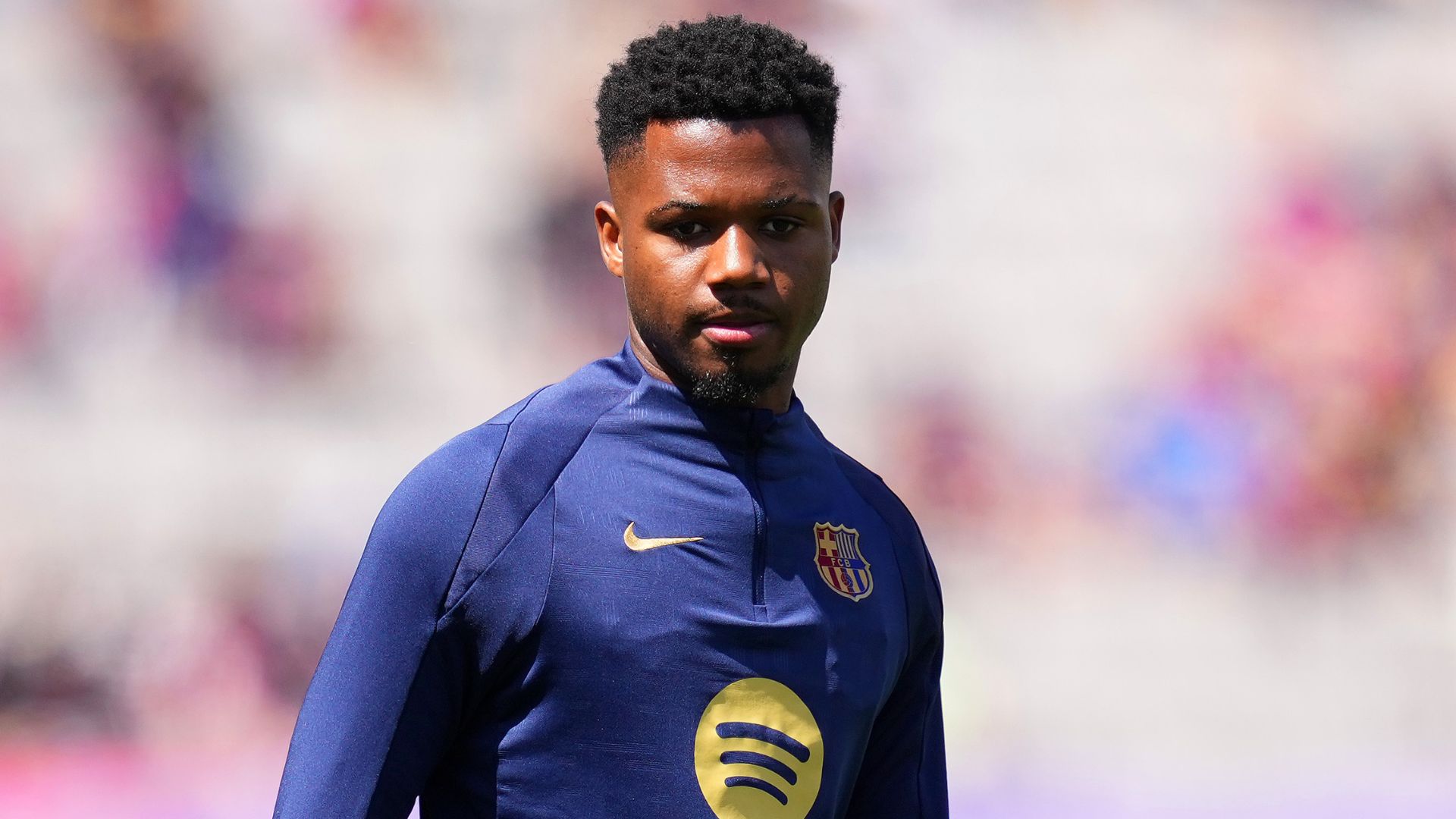 Ansu Fati of FC Barcelona looks on during the warm up prior to the LaLiga match between FC Barcelona and Real Madrid CF at Estadi Olimpic Lluis Companys on May 11, 2025 in Barcelona, Spain.