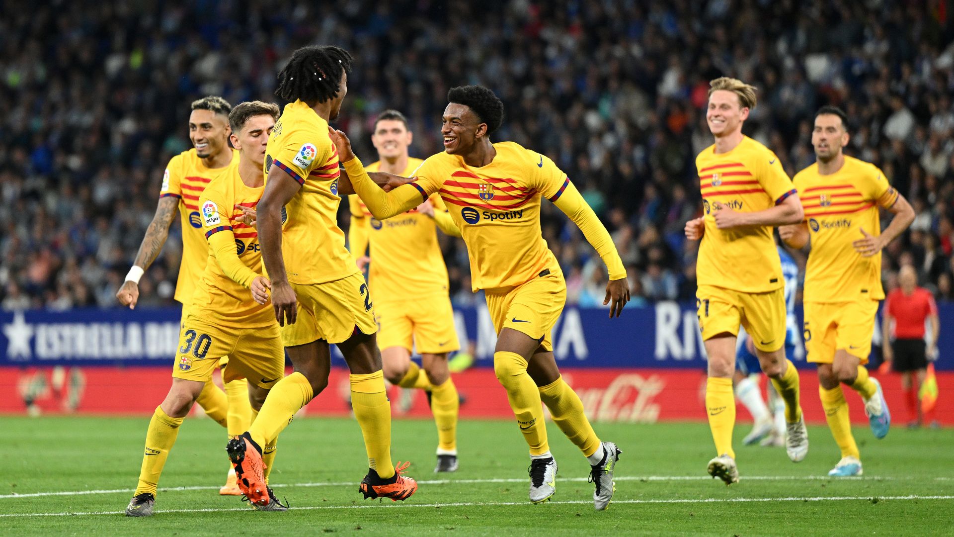 Jules Kounde of FC Barcelona celebrates with Alejandro Balde after scoring the team's fourth goal during the LaLiga Santander match between RCD Espanyol and FC Barcelona at RCDE Stadium on May 14, 2023 in Barcelona, Spain.