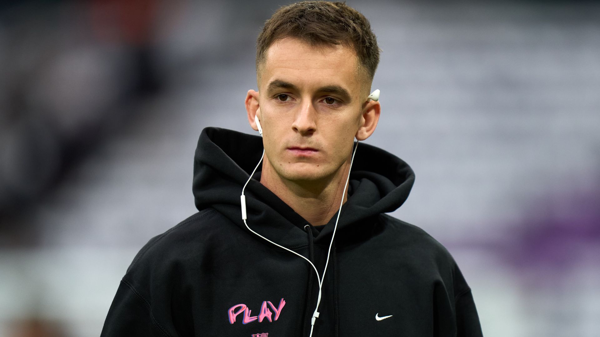 Marc Casado of FC Barcelona looks on as he inspects the pitch prior to the LaLiga EA Sports match between Real Madrid CF and FC Barcelona at Estadio Santiago Bernabeu on October 26, 2025 in Madrid, Spain.