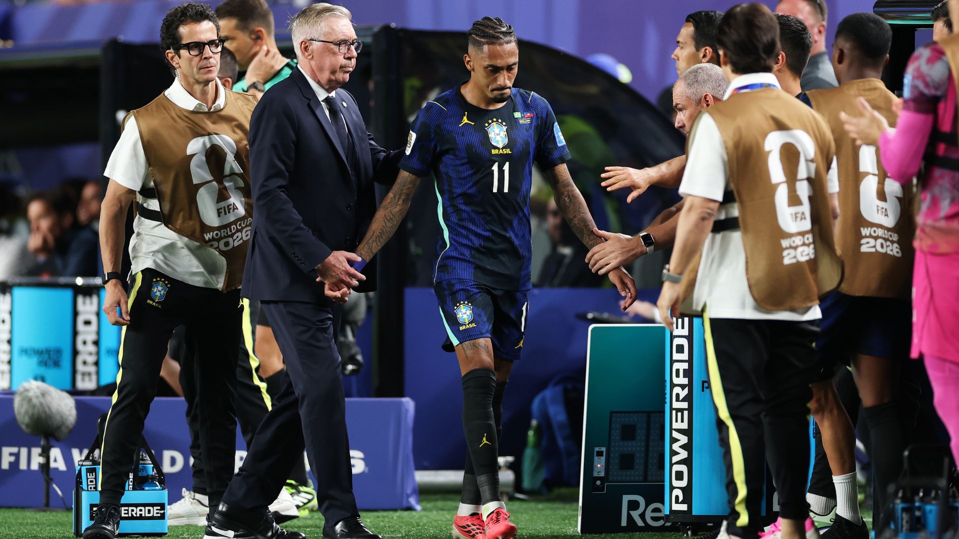 Raphinha #11 of Brazil reacts alongside Carlo Ancelotti, Head Coach of Brazil, as he leaves the pitch with an injury during the FIFA World Cup 2026 Group C match between Brazil and Haiti at Philadelphia Stadium on June 19, 2026 in Philadelphia, Pennsylvania.