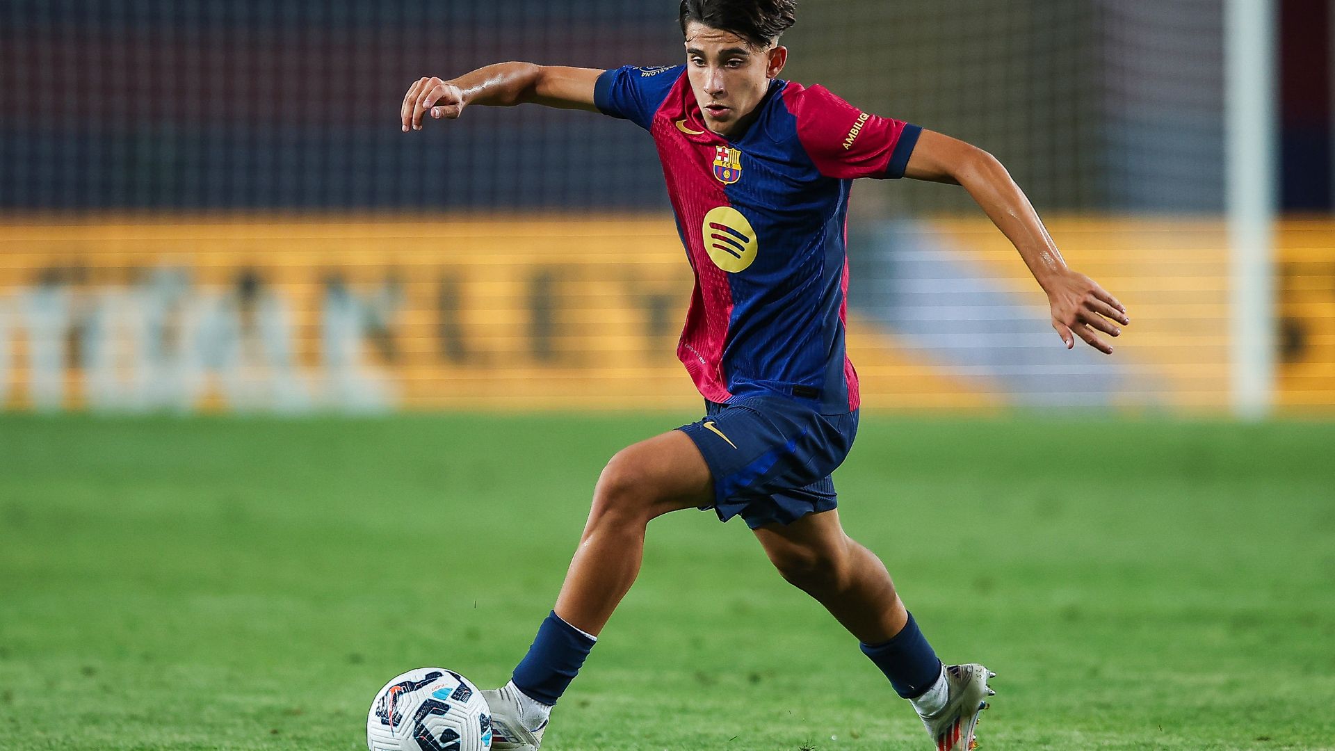 Toni Fernandez of FC Barcelona run with the ball during the Joan Gamper Trophy match between FC Barcelona and AS Monaco at Estadi Olimpic Lluis Companys on August 12, 2024 in Barcelona, Spain.