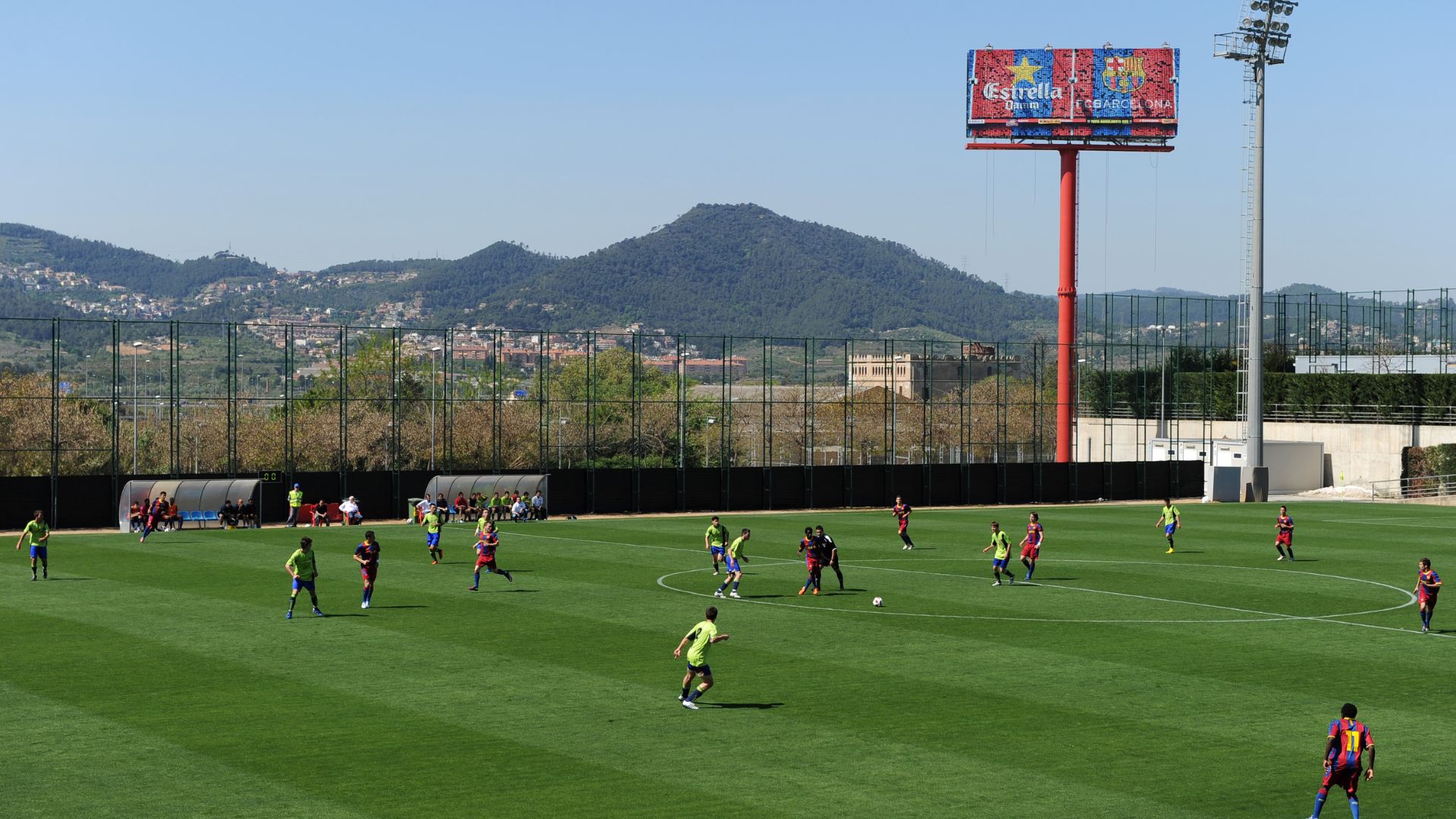 BARCELONA, SPAIN - APRIL 09: Barcelona youth players play a match on one of the pitches at the Joan Camper training ground on April 9, 2011 in Barcelona, Spain. Every weekend various teams of Barcelona youth players play in matches with the hope of one day making it to the top.