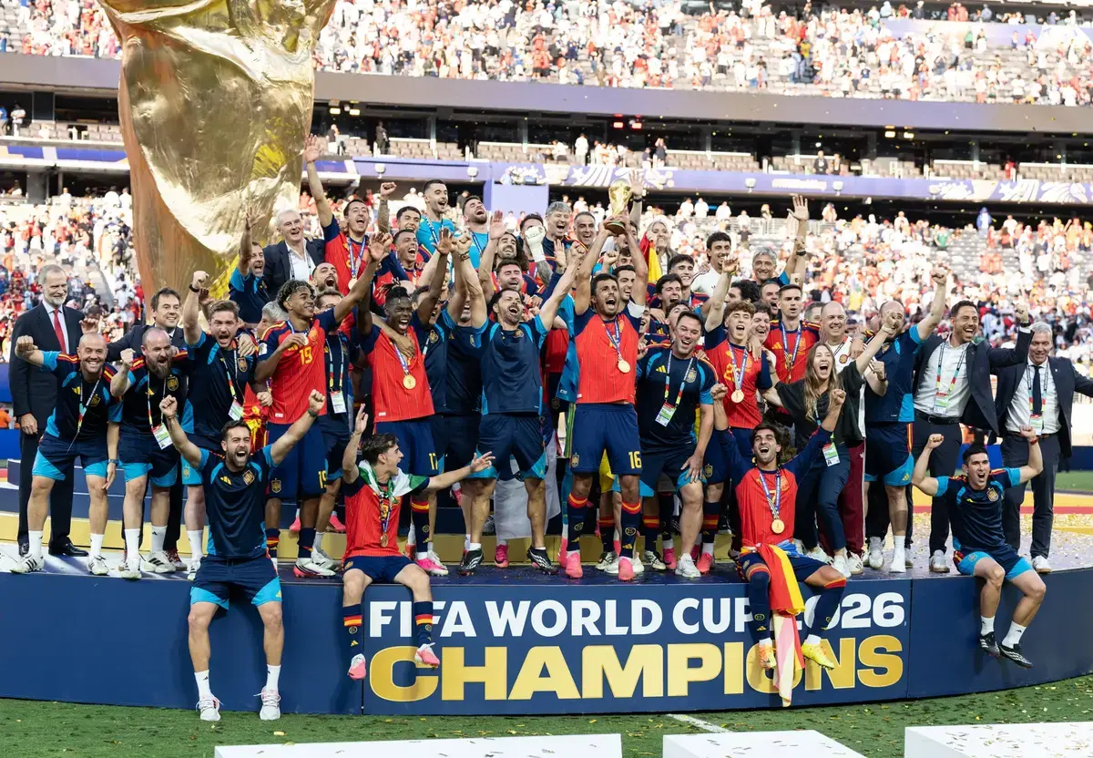 King Felipe VI of Spain (L) joined as Spain National team and supporting staff celebrates winning final game against Argentina during FIFA World Cup 2026 at New York New Jersey Stadium at Rutherford in New Jersey, USA on July 19, 2026.