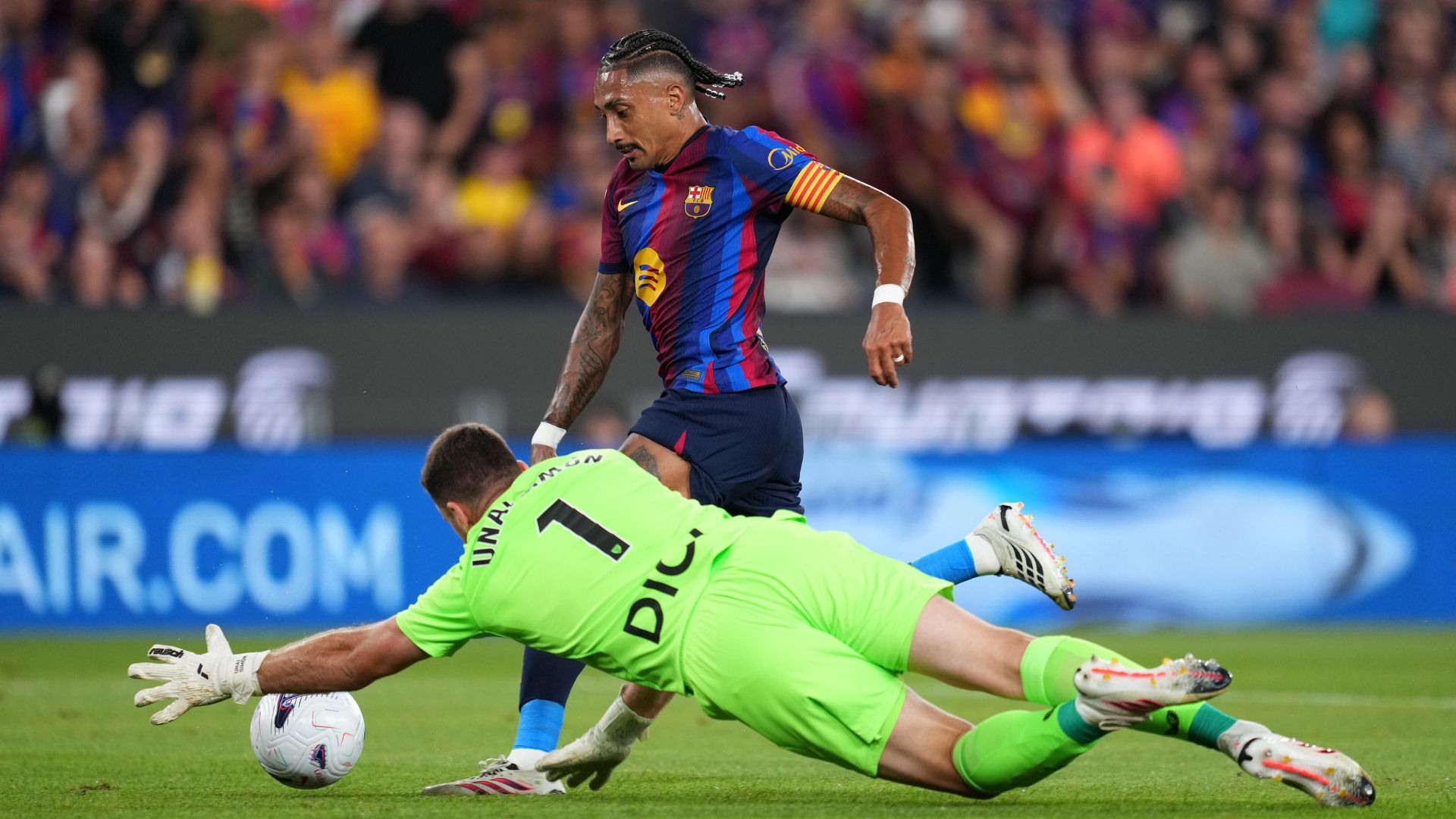 BARCELONA, SPAIN - AUGUST 27: Raphinha of Barcelona gets past Unai Simon of Athletic Bilbao to score his team’s first goal during the LaLiga EA Sports 2026/27 match between FC Barcelona and Athletic Club at Spotify Camp Nou on August 27, 2026 in Barcelona, Spain.